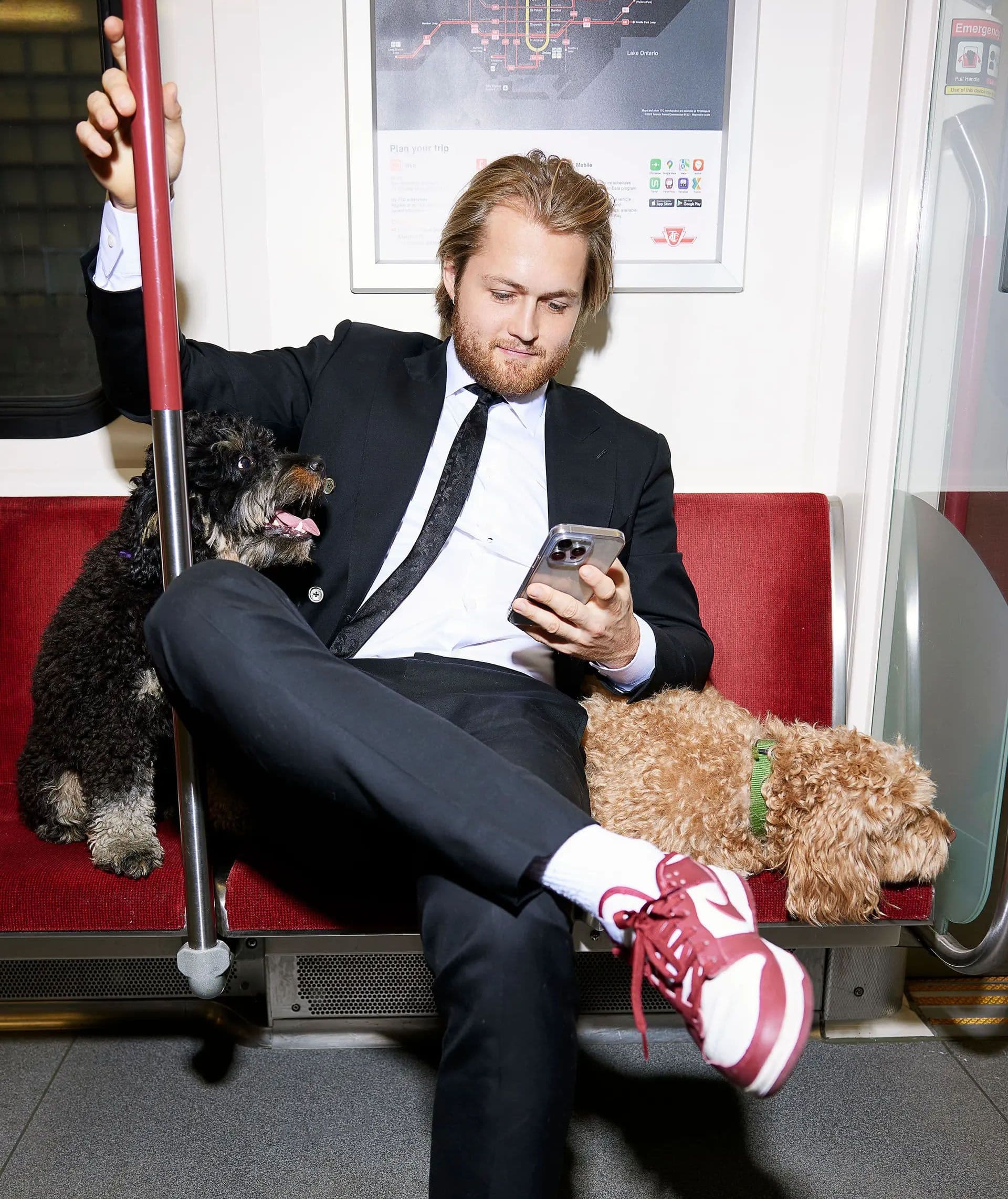 William Nylander on a Toronto subway with two dogs